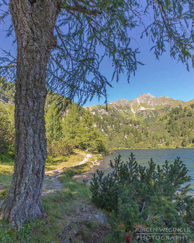 edelrautehütte, hauseck, berge, sonnenaufgang, hohentauern, steiermark, bergwelten, wandern, großer scheibelsee, gegenlichtaufnahme, fototipps, see in österreich